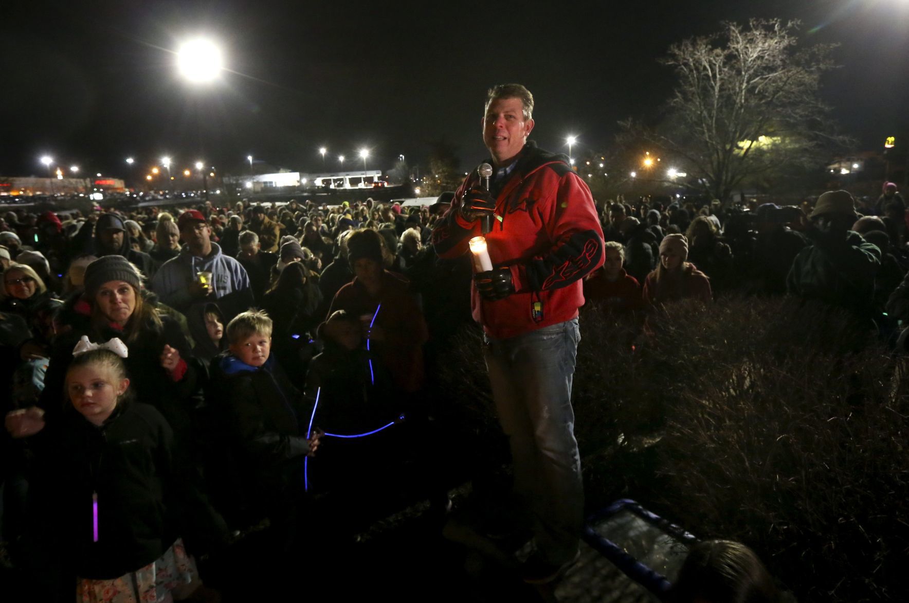 Shock, sorrow at candlelight vigil for St. Charles family